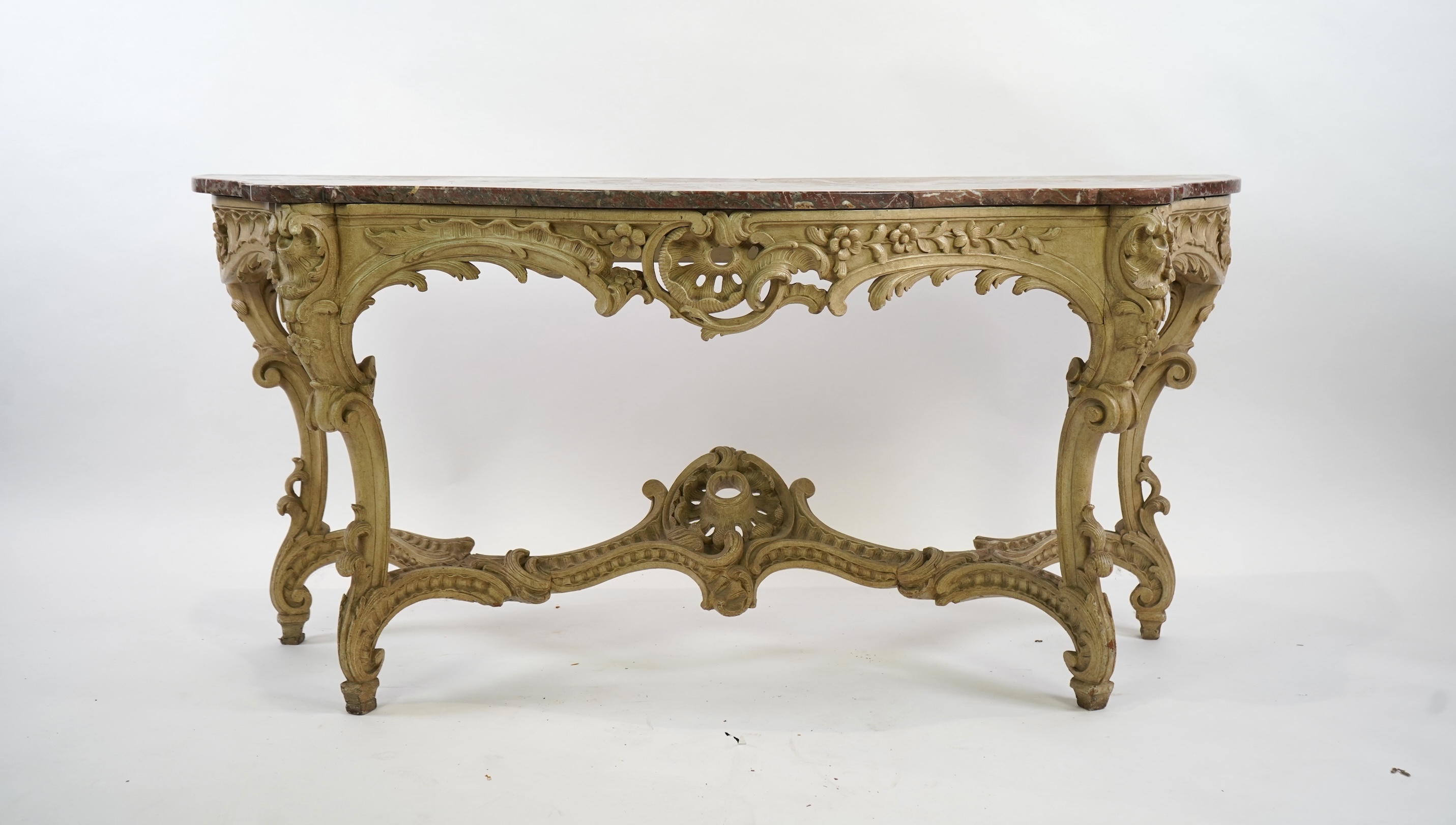 A 19th century Louis XV style marble topped painted serpentine console table